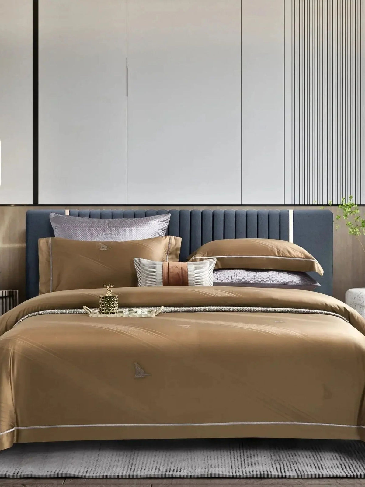 Golden-brown jacquard bedsheet set with a tonal woven pattern, styled on a bed with striped and solid pillow covers