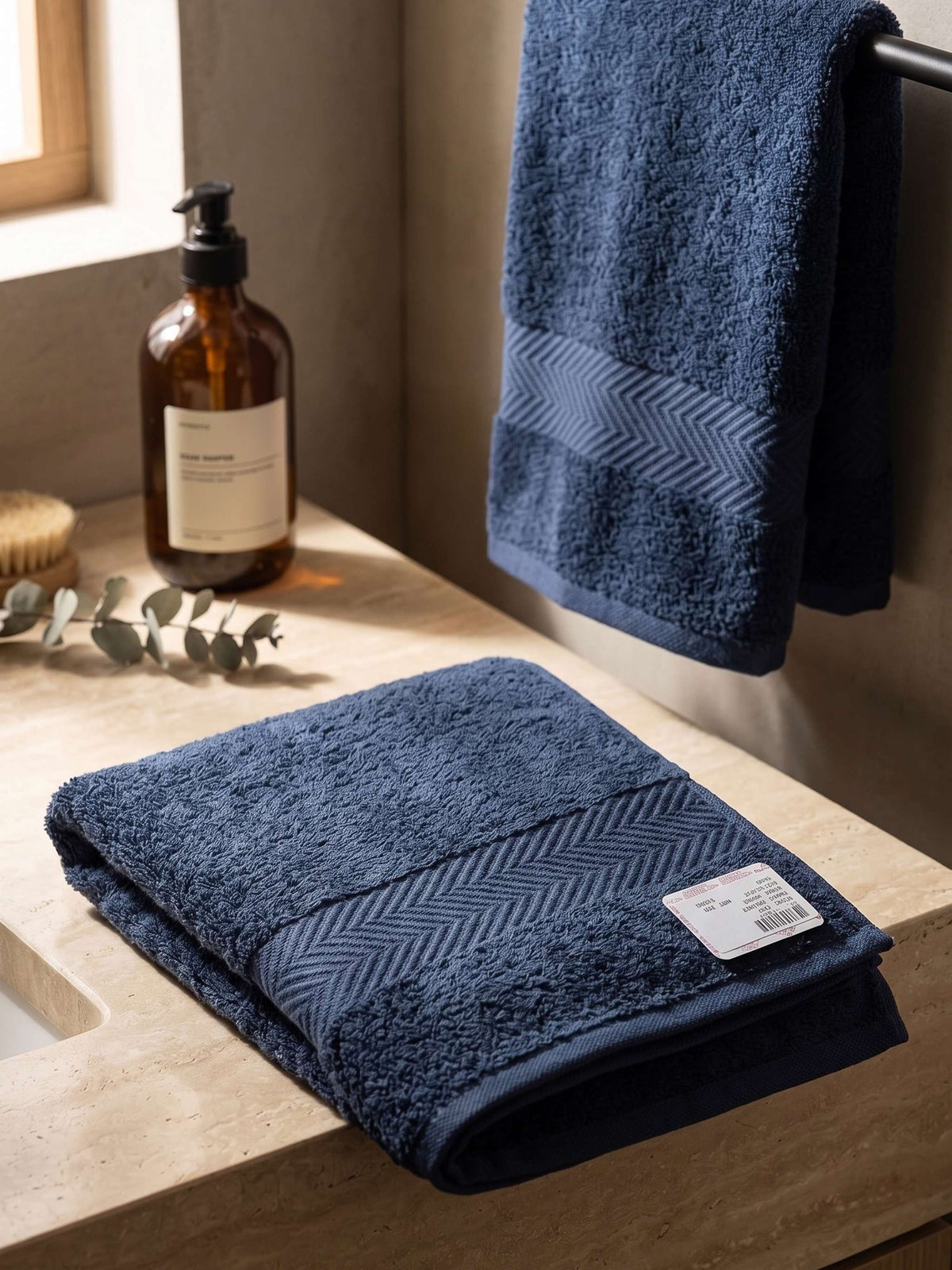 Navy blue cotton bath towel with chevron woven border 
