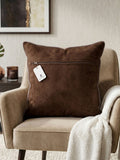 Brown geometric printed cushion cover featuring an abstract circular pattern in brown and beige tones