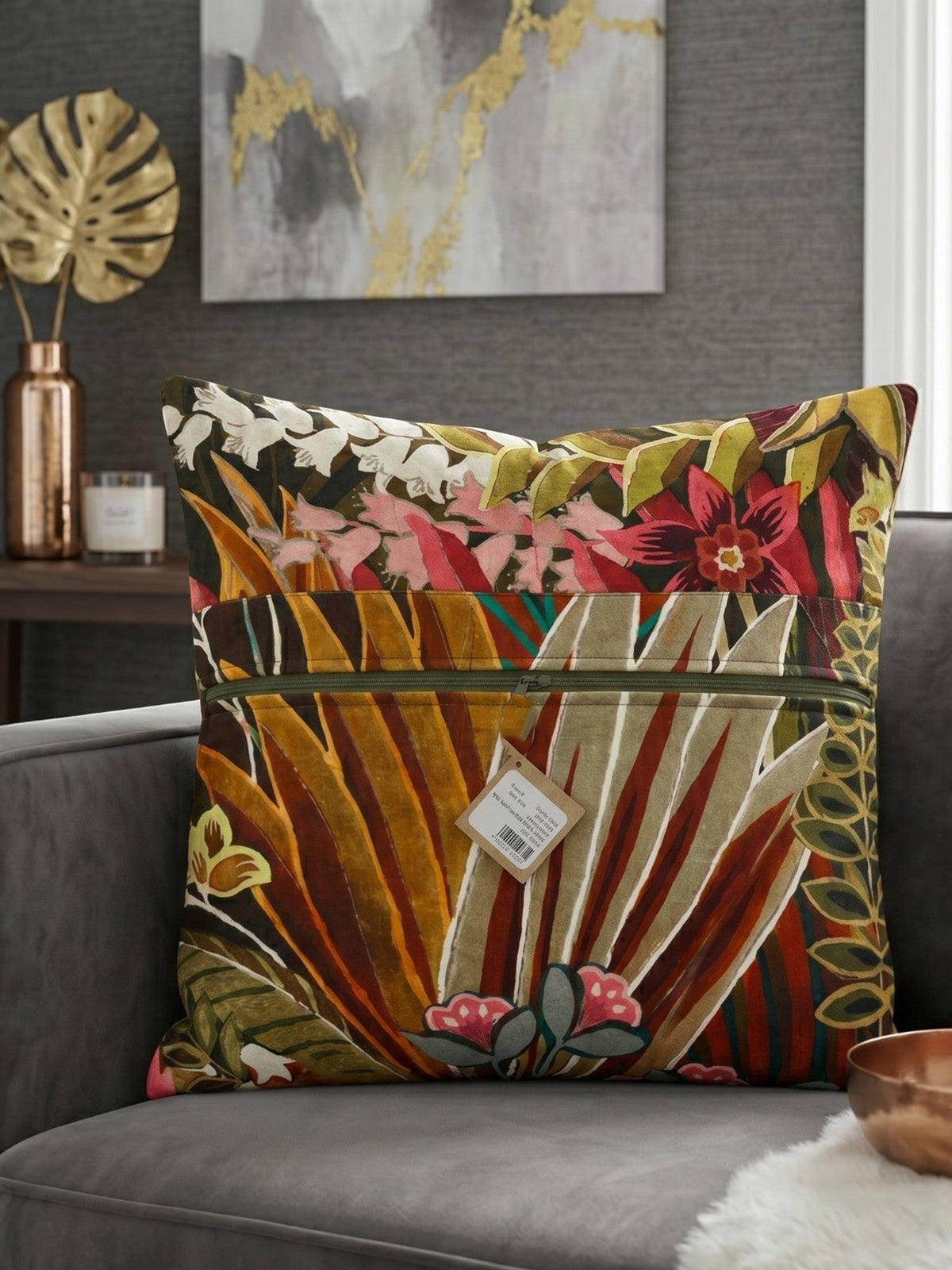 Tropical botanical printed cotton cushion cover featuring colorful leaves and floral motifs on a sofa