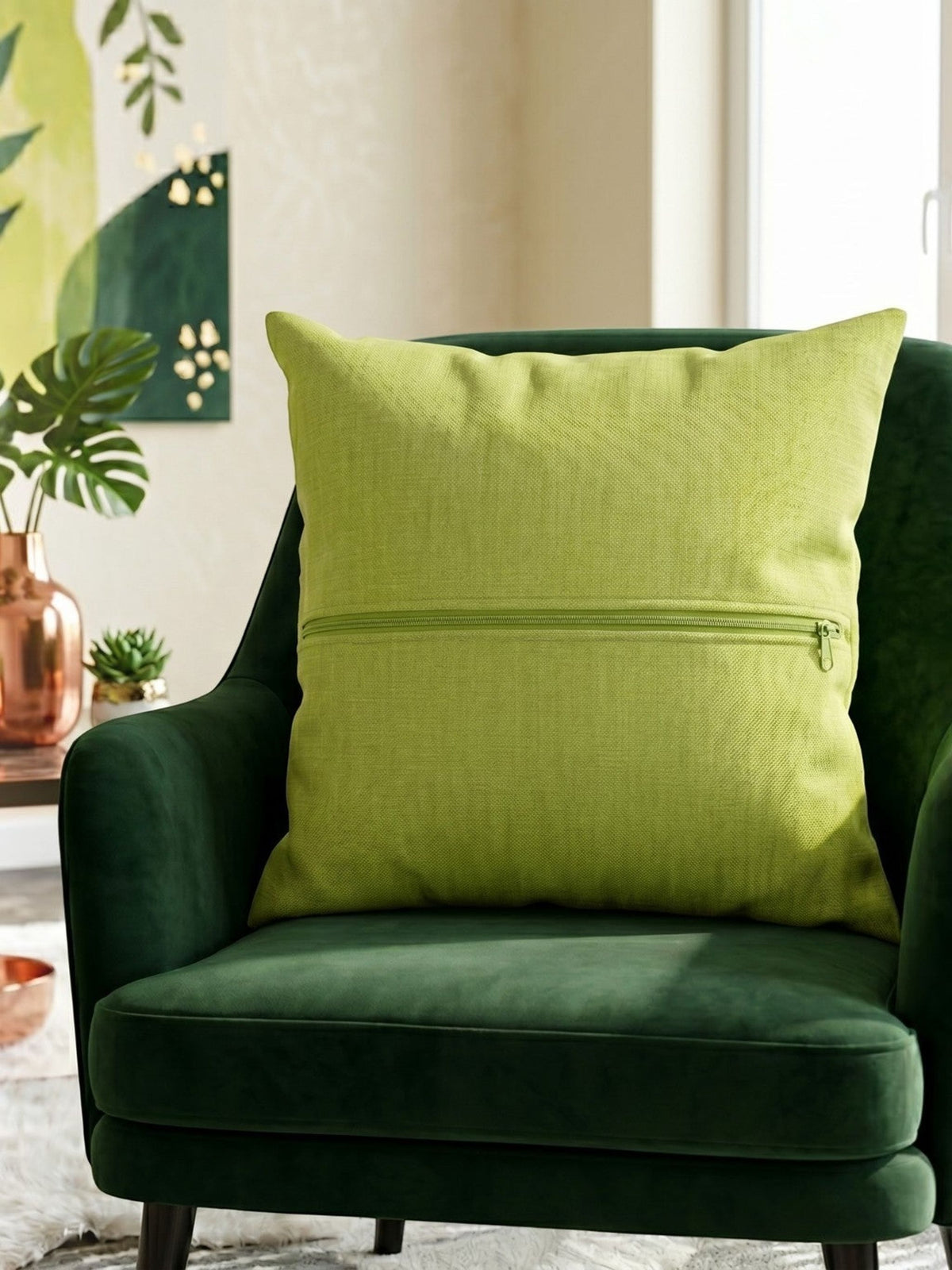 Green plain cotton cushion cover with subtle woven texture displayed on a dark green accent chair