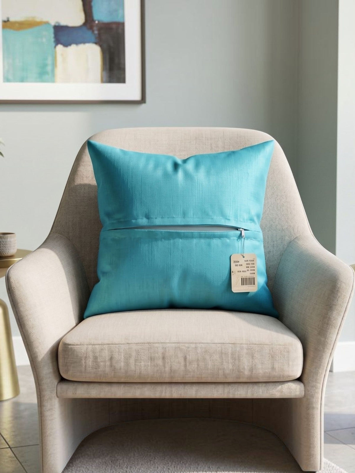 Blue plain polysilk cushion cover on a beige accent chair with a smooth solid color finish