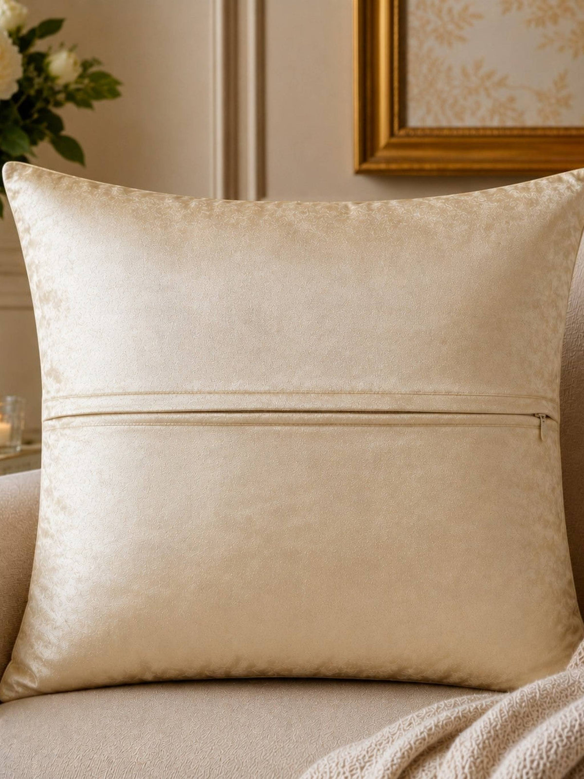 Jagdish Store 16x16 cream cushion cover with gold and burgundy floral embroidery and delicate beadwork accents.
