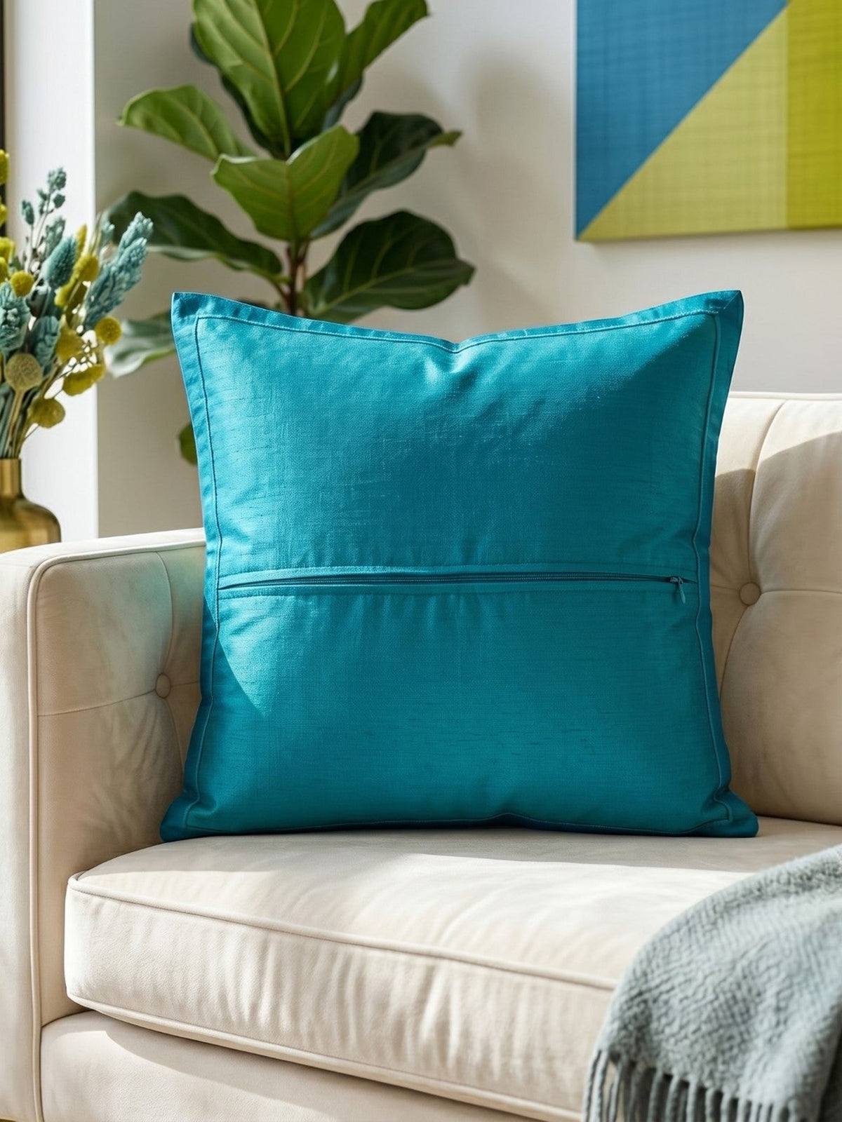 Jagdish Store decorative cushion cover with blue floral polysilk appliqué on a textured lime green polysilk-blend background.