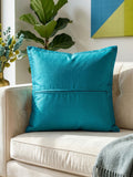 Jagdish Store decorative cushion cover with blue floral silk appliqué on a textured lime green silk-blend background.