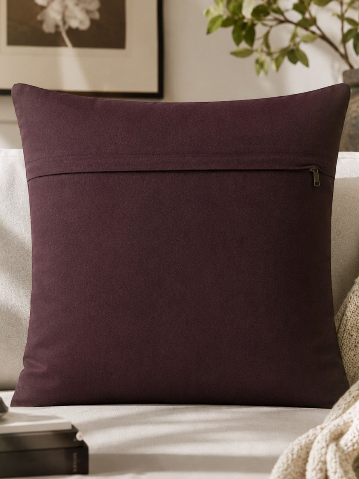 Plain aubergine velvet reverse of the foil-printed cushion cover