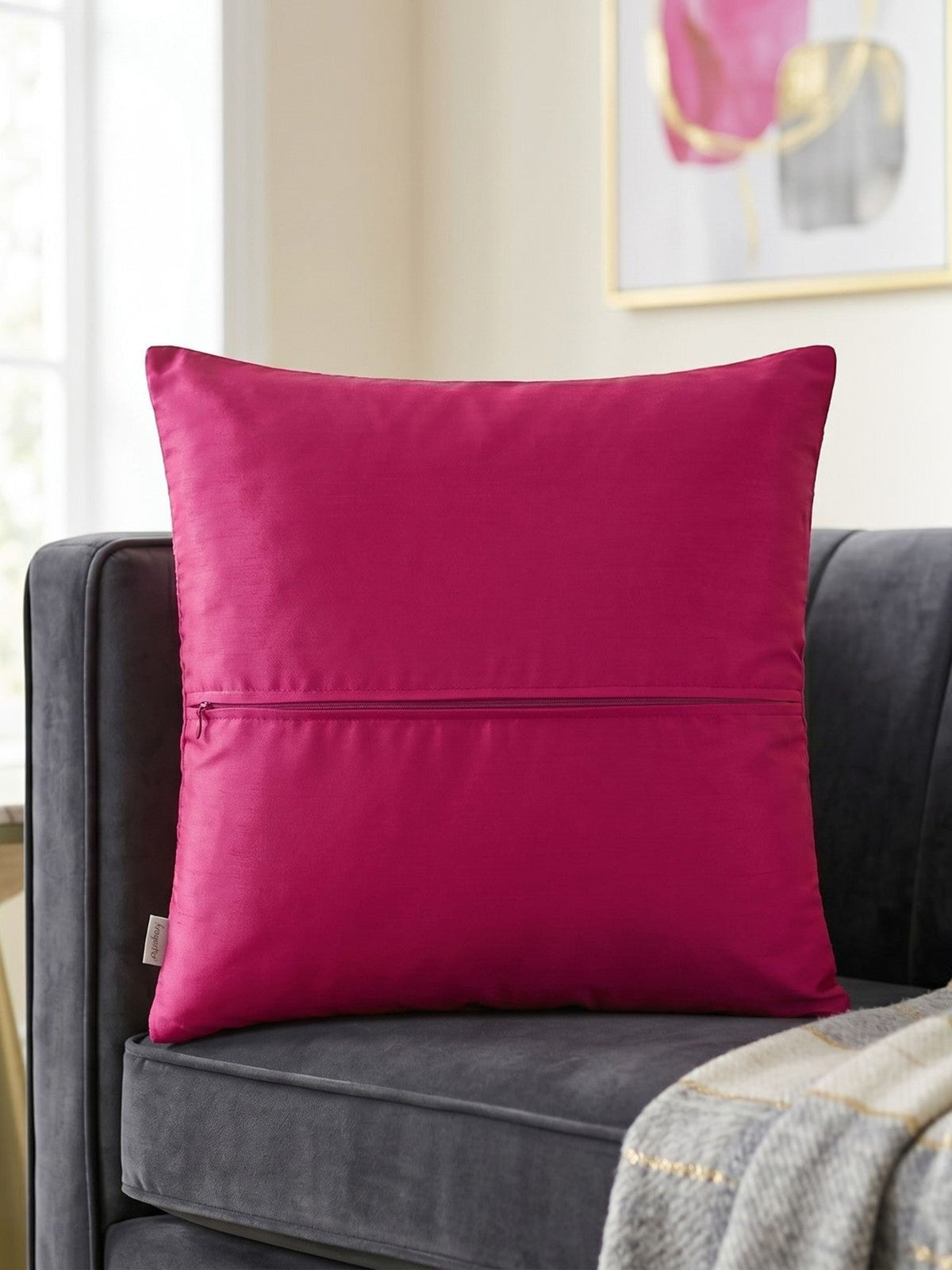 Jagdish Store fuchsia decorative square throw cushion cover with a radiating pleated design and central rosette.
