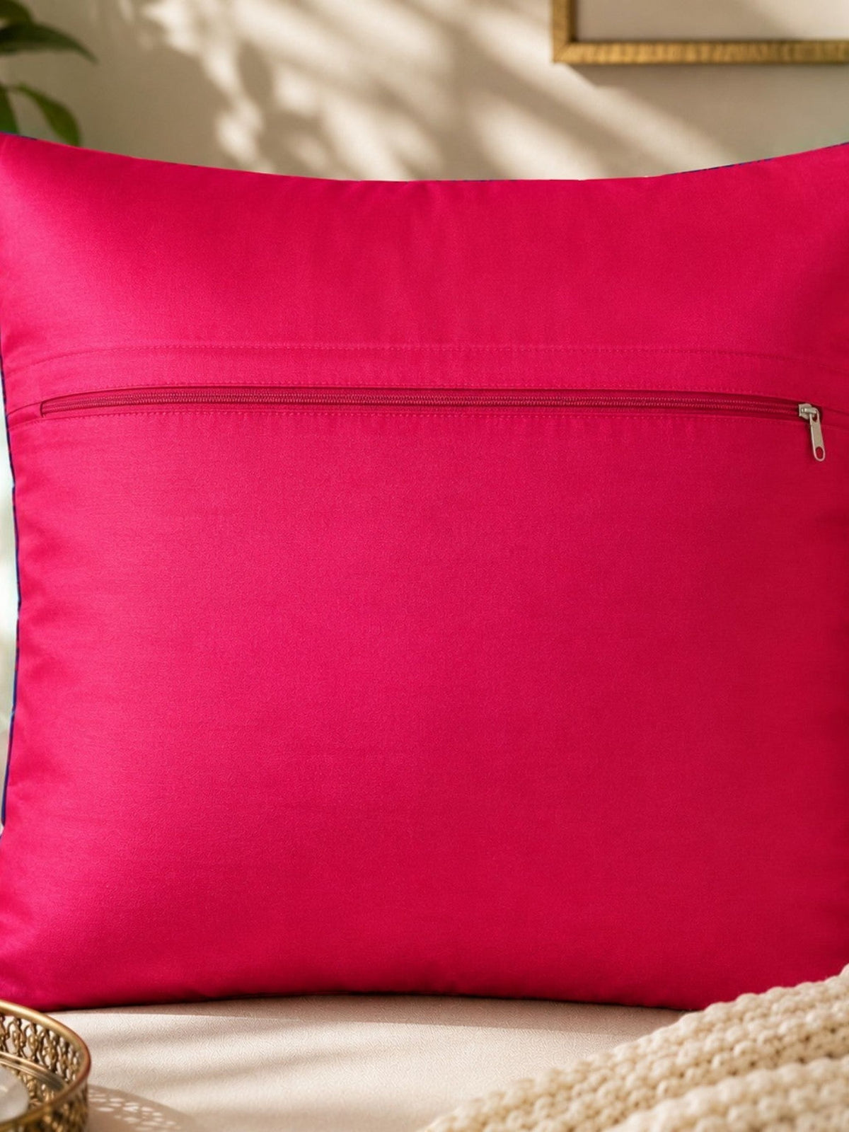 Jagdish Store reversible throw cushion cover with yellow scooter and pink and blue paisley print on navy fabric.