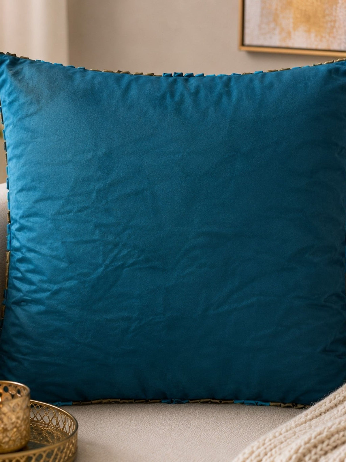 Jagdish Store decorative cushion cover with teal, turquoise, and bronze fabric ribbons in concentric circles.