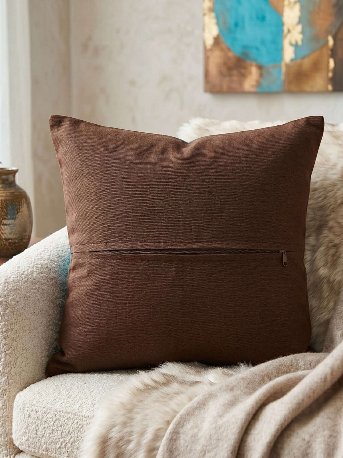 Jagdish Store turquoise cushion cover with a brown triskele spiral pattern and matching border.