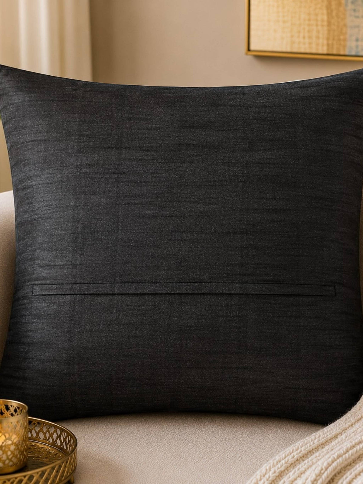 Jagdish Store black decorative throw cushion cover with pleated vertical channels revealing vibrant red accents.