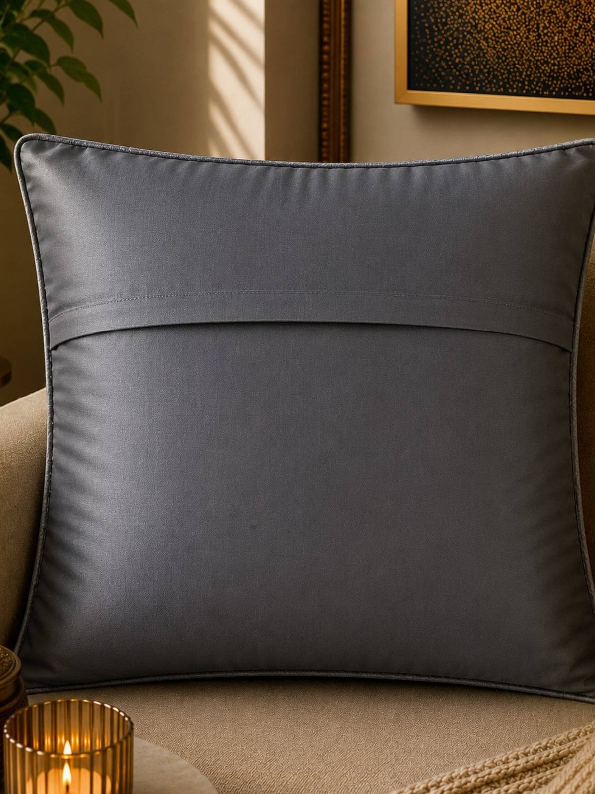 Jagdish Store grey textured cushion cover with overlapping circular discs and colorful rings in neon pink, teal, orange, and lime green.