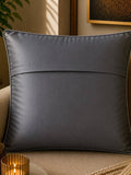 Jagdish Store grey textured cushion cover with overlapping circular discs and colorful rings in neon pink, teal, orange, and lime green.