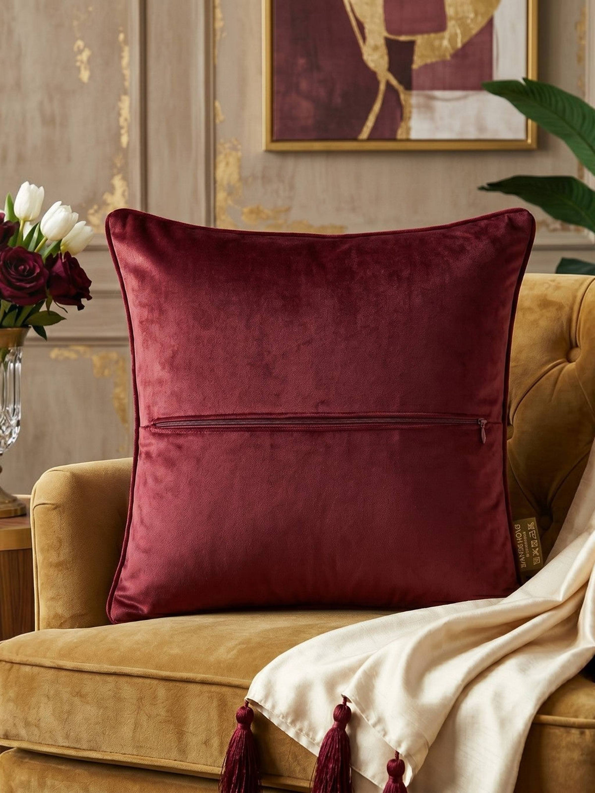 Jagdish Store maroon velvet cushion cover with intricate beaded mandala embroidery and decorative crystal accents.