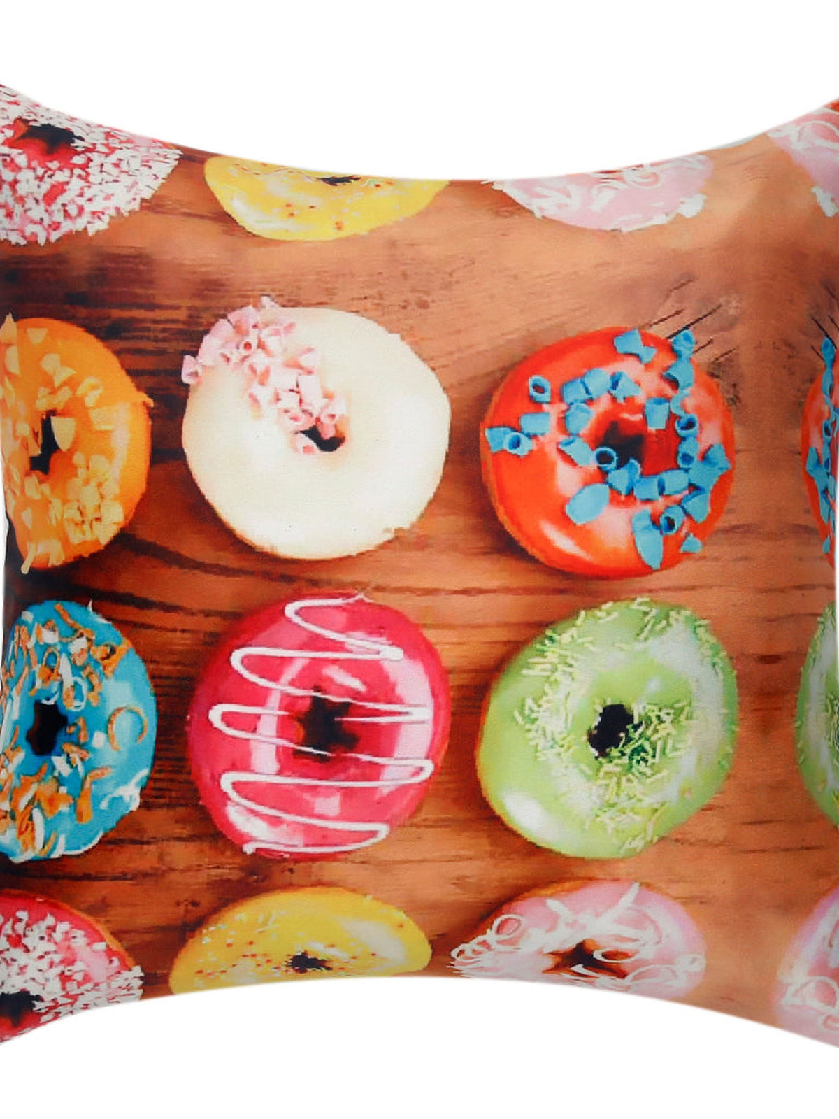 Cushion cover printed with iced doughnuts in bright colours on a wooden background