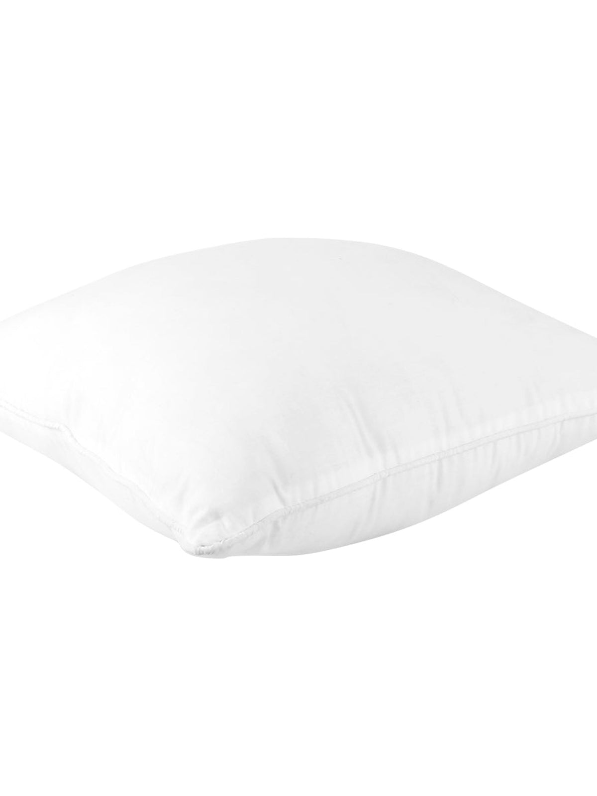 White polyfill cushion insert resting on its side, showing the loft of the filling