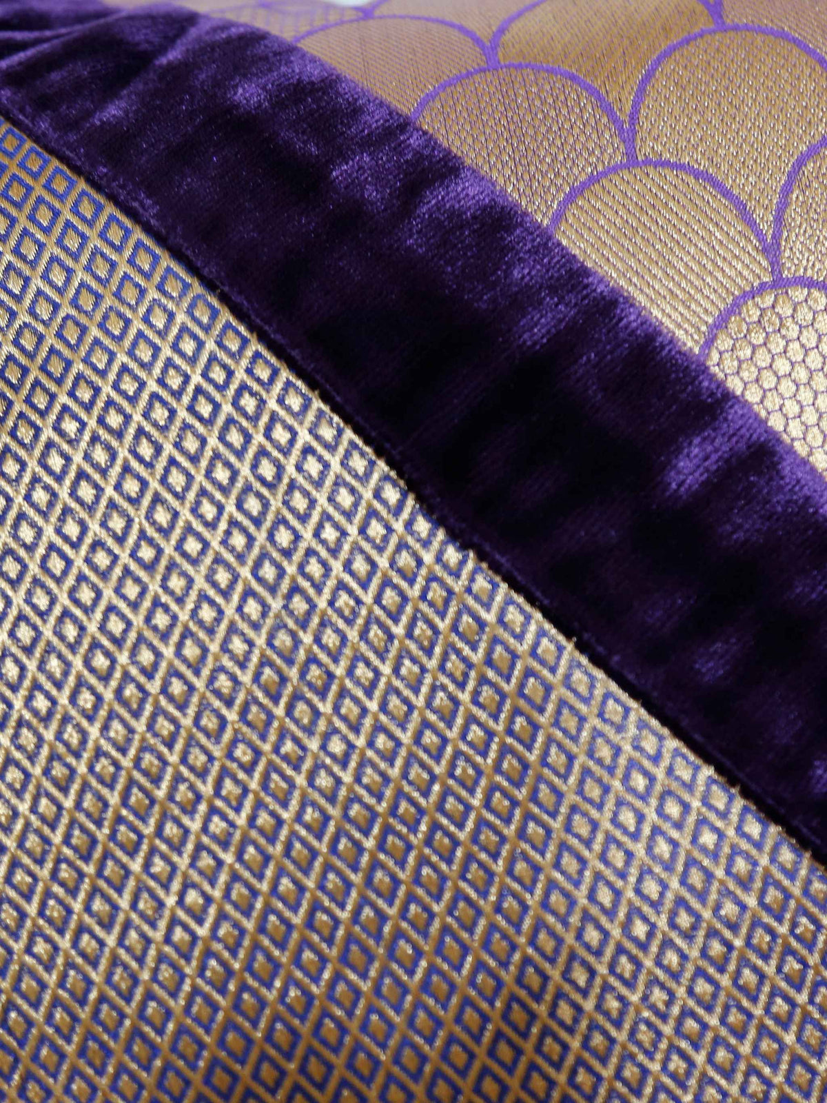 Close-up of the gold scallop and diamond brocade beside the purple velvet band