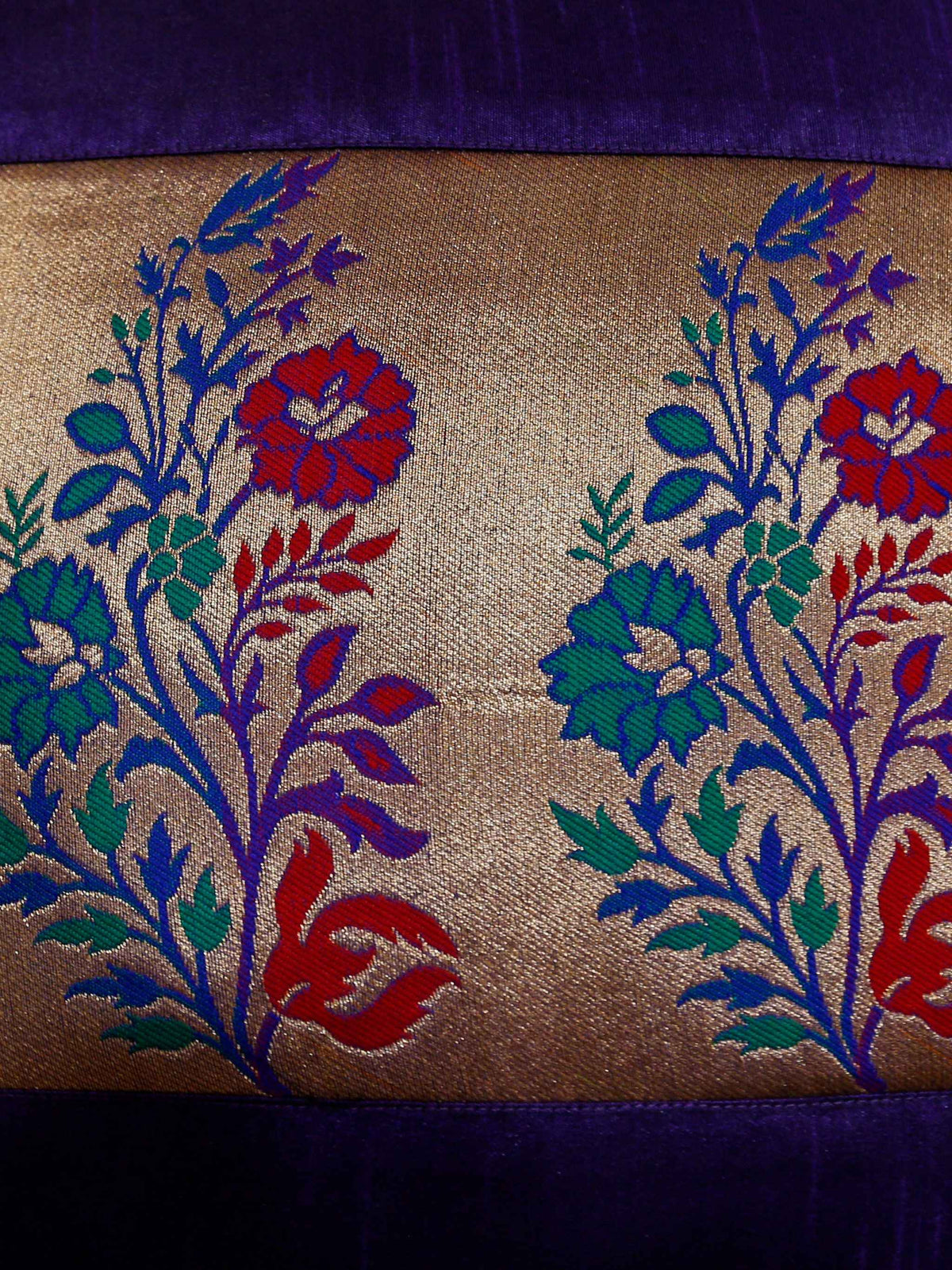 Close-up of the gold brocade panel with red, blue and teal woven flowers