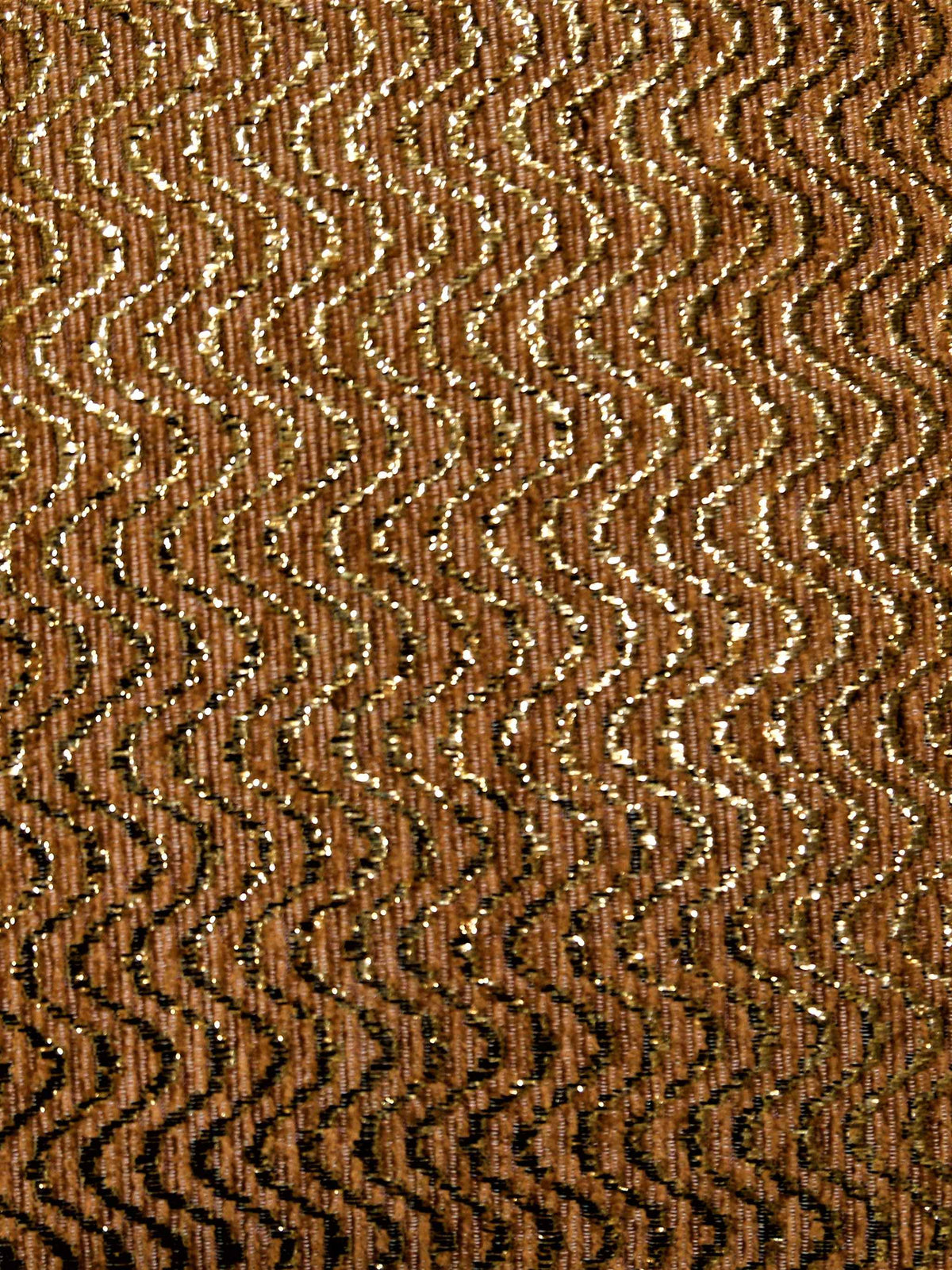 Close-up of the gold lurex wavy chevron weave