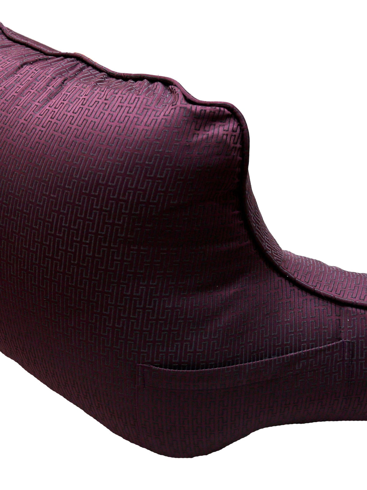 Shaped plum jacquard back support cushion seen from the side, with piped edge