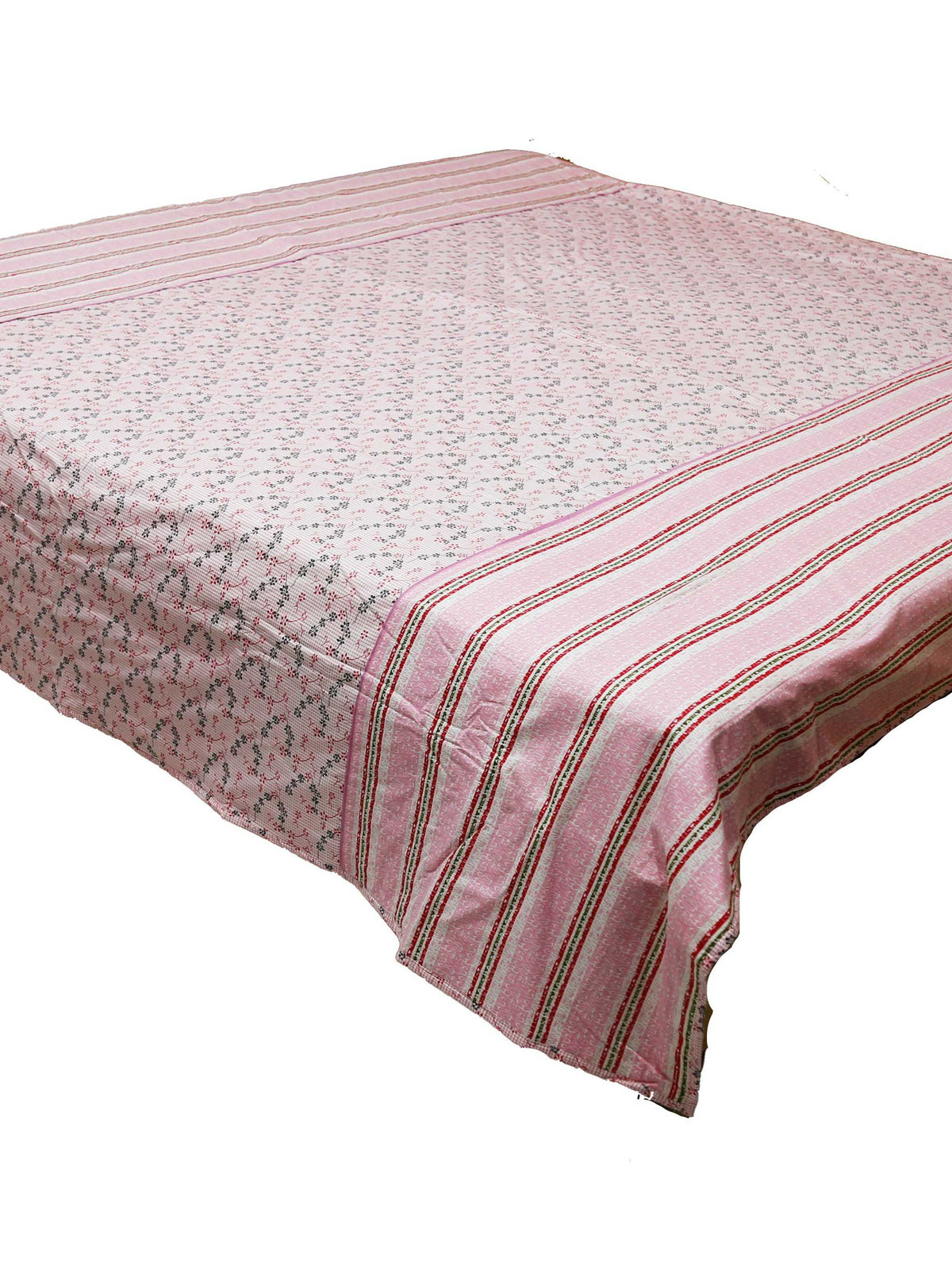 Dusty pink floral dohar draped over a bed, striped border falling down the side