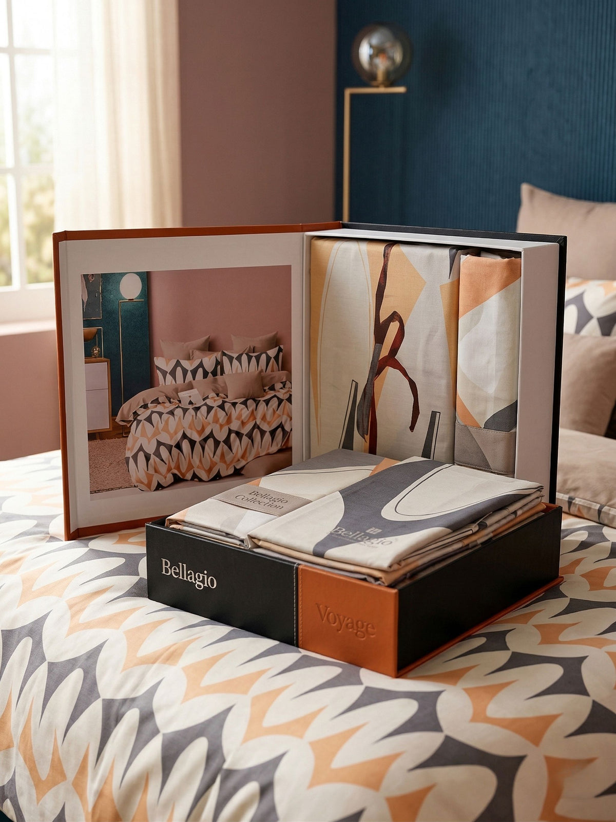Open Voyage gift box showing the folded bedsheet and the design photo in the lid