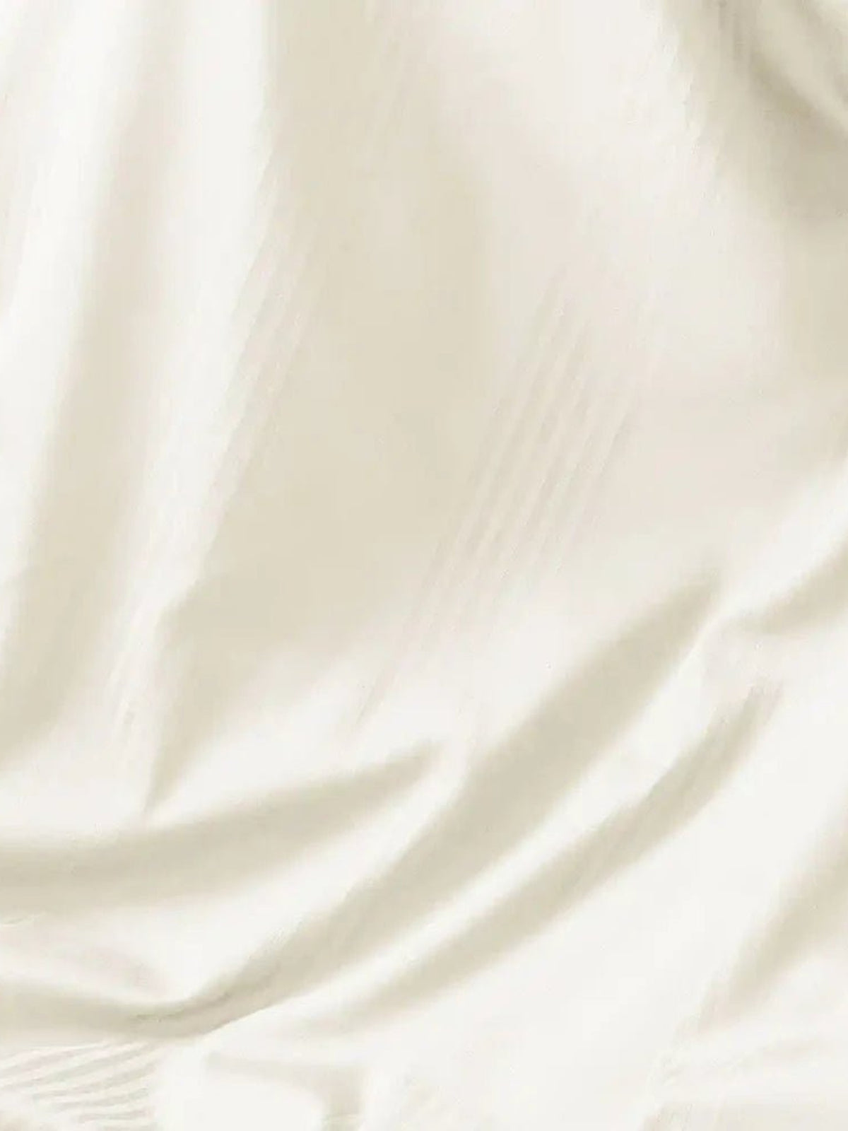 Close-up of ivory satin stripe cotton showing the woven stripe and sheen