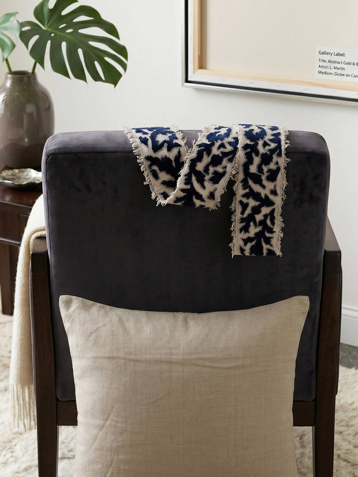 Beige cushion cover with detachable black patterned accent strip