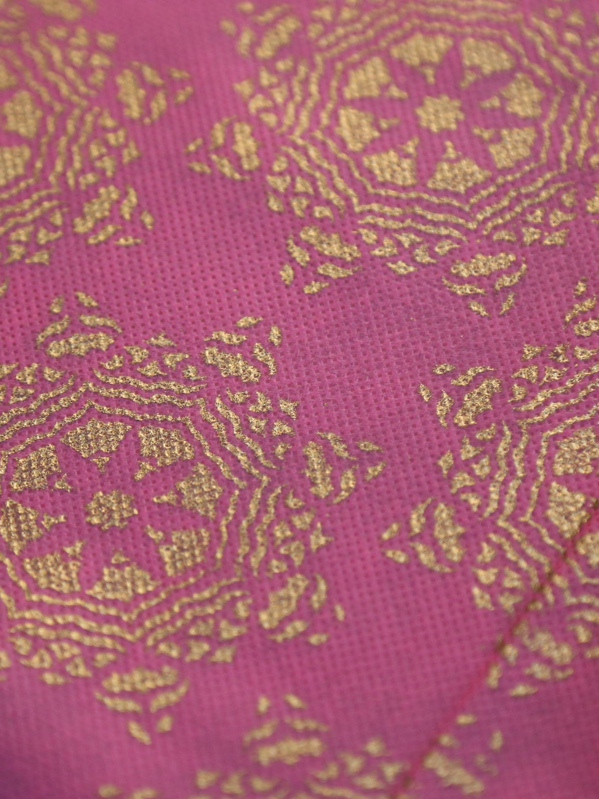 Gold-beige table cover with a contrasting pink brocade panel woven down the centre
