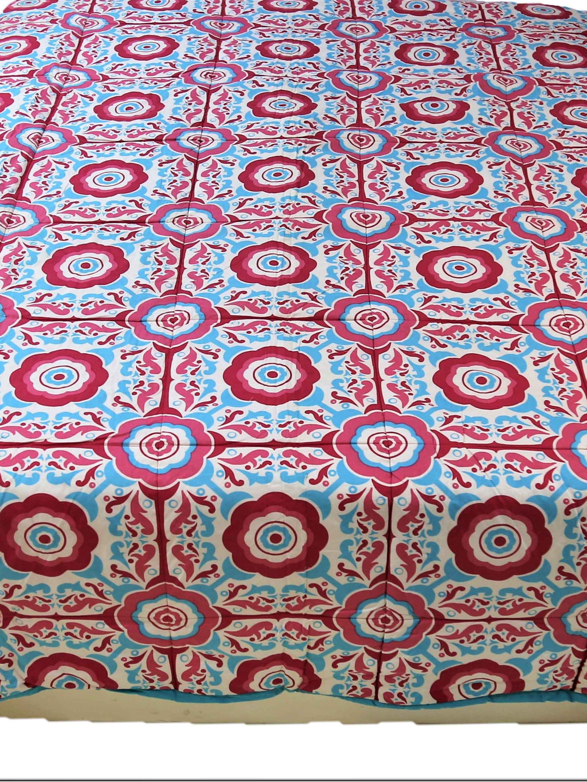 Pink floral print reversible cotton AC quilt for a double bed