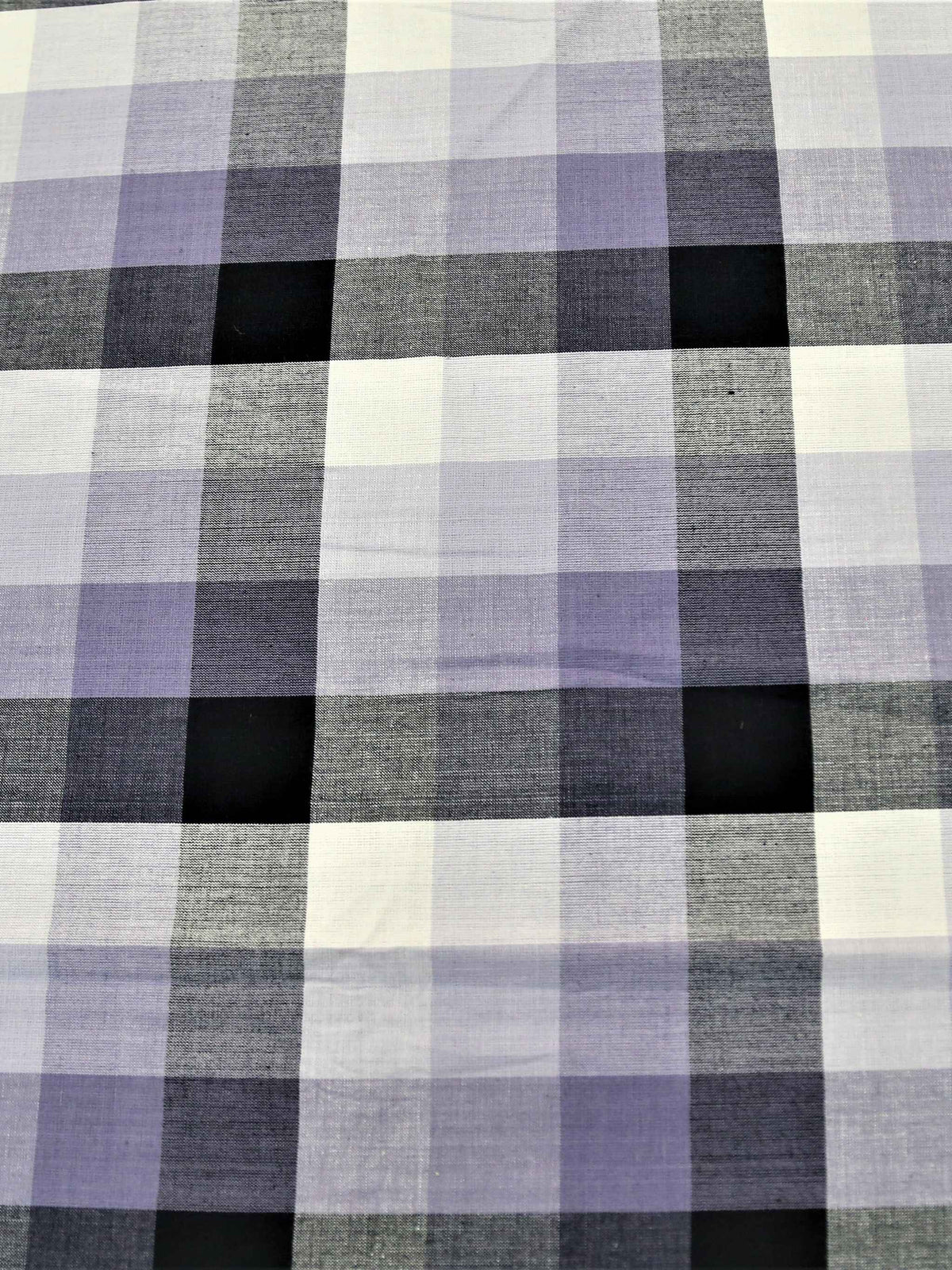 White, lavender, and black buffalo-check plaid oval table cover