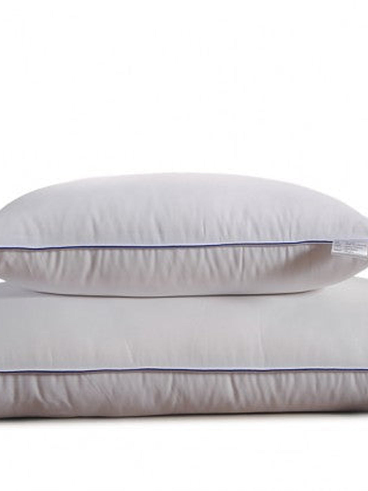 Two Homescapes Cloud pillows stacked, showing the navy piped edge