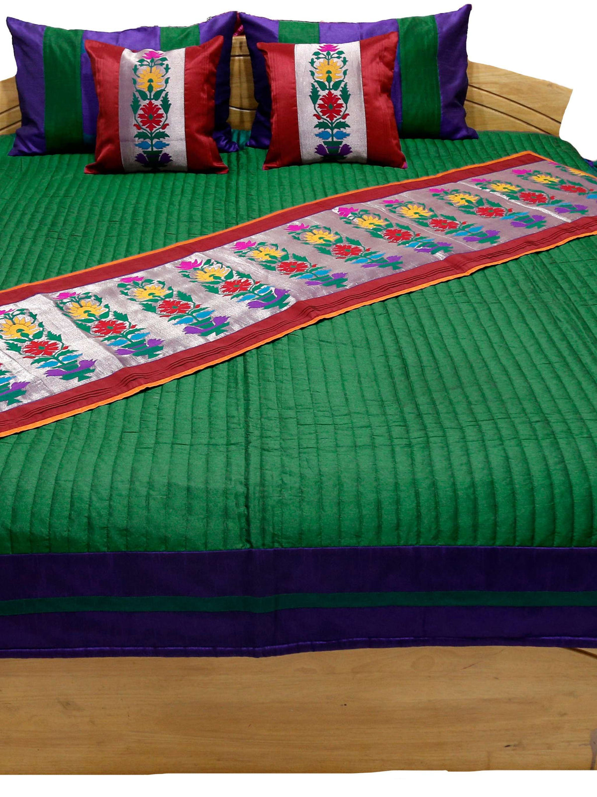Green side of the reversible bedcover shown flat