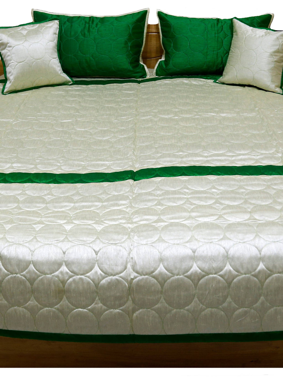 Ivory circle quilted side laid flat with green border and matching cushions