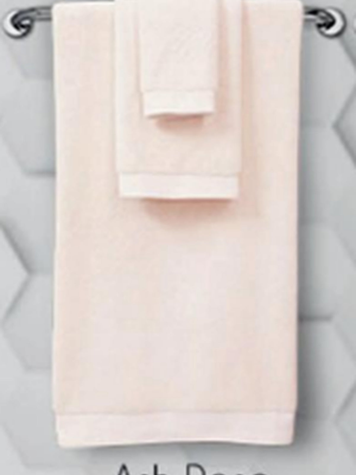 Pale blush cotton towel set hanging on a rail, Resort Towel in Ad Rose