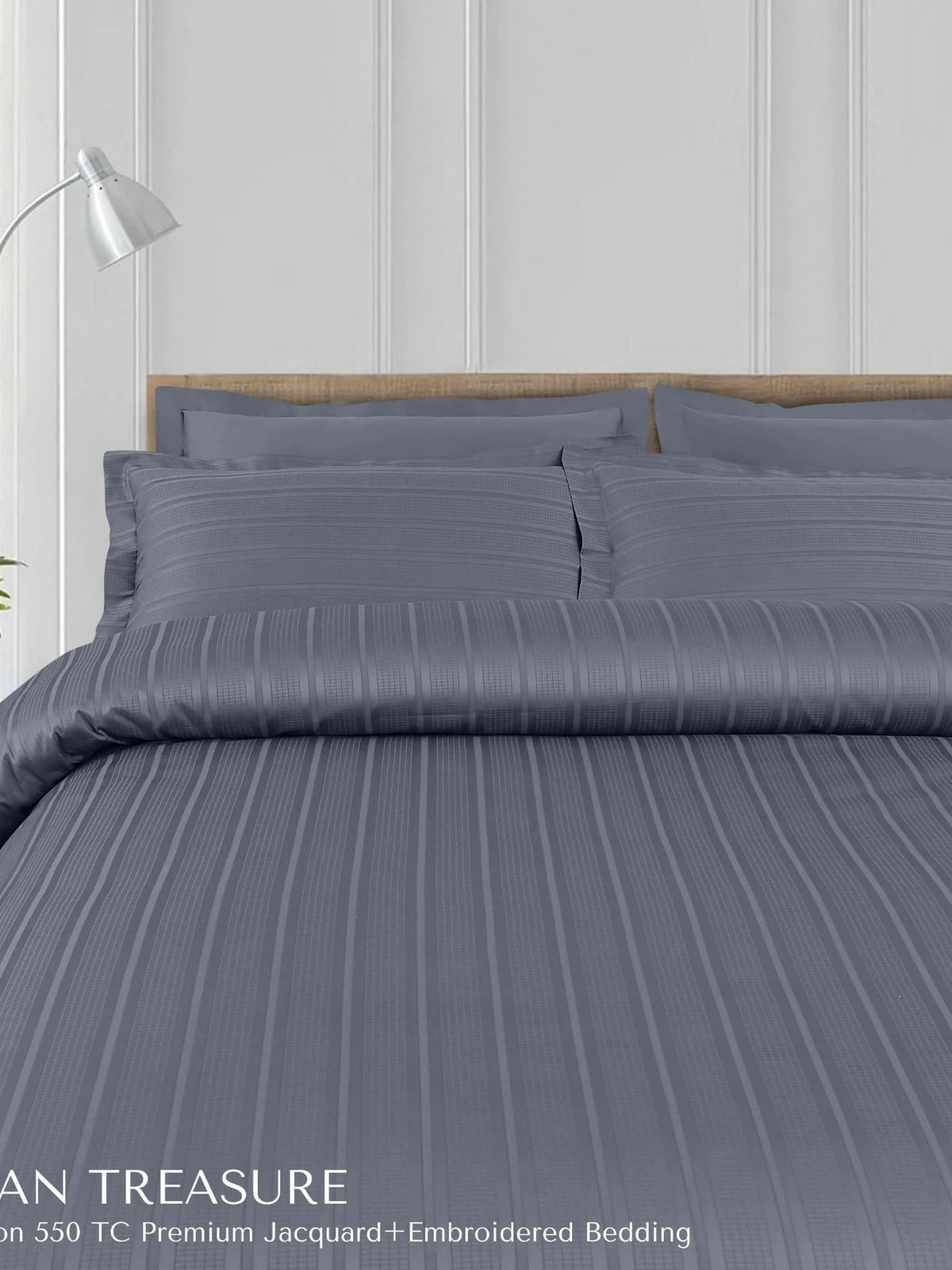 Charcoal blue satin-stripe jacquard bedding made up on a bed, Tuscan Treasure 550TC