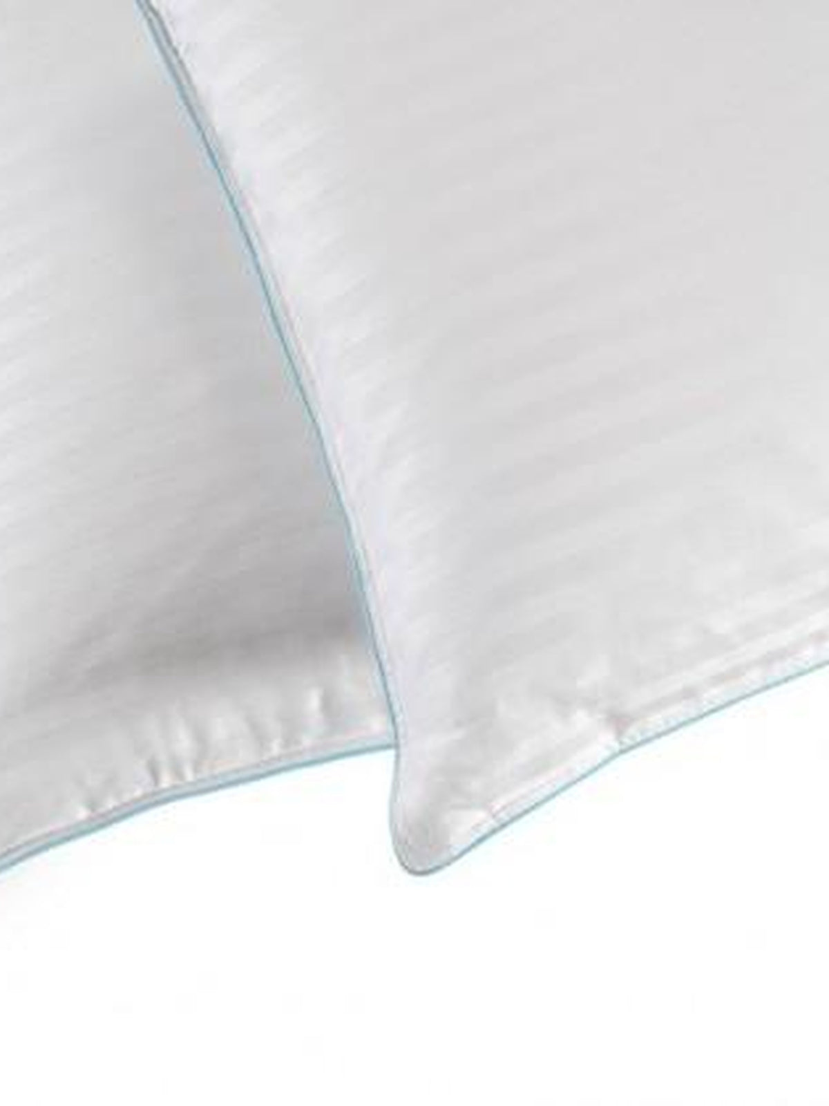 Close-up of the piped corner of the white satin stripe Regent pillow