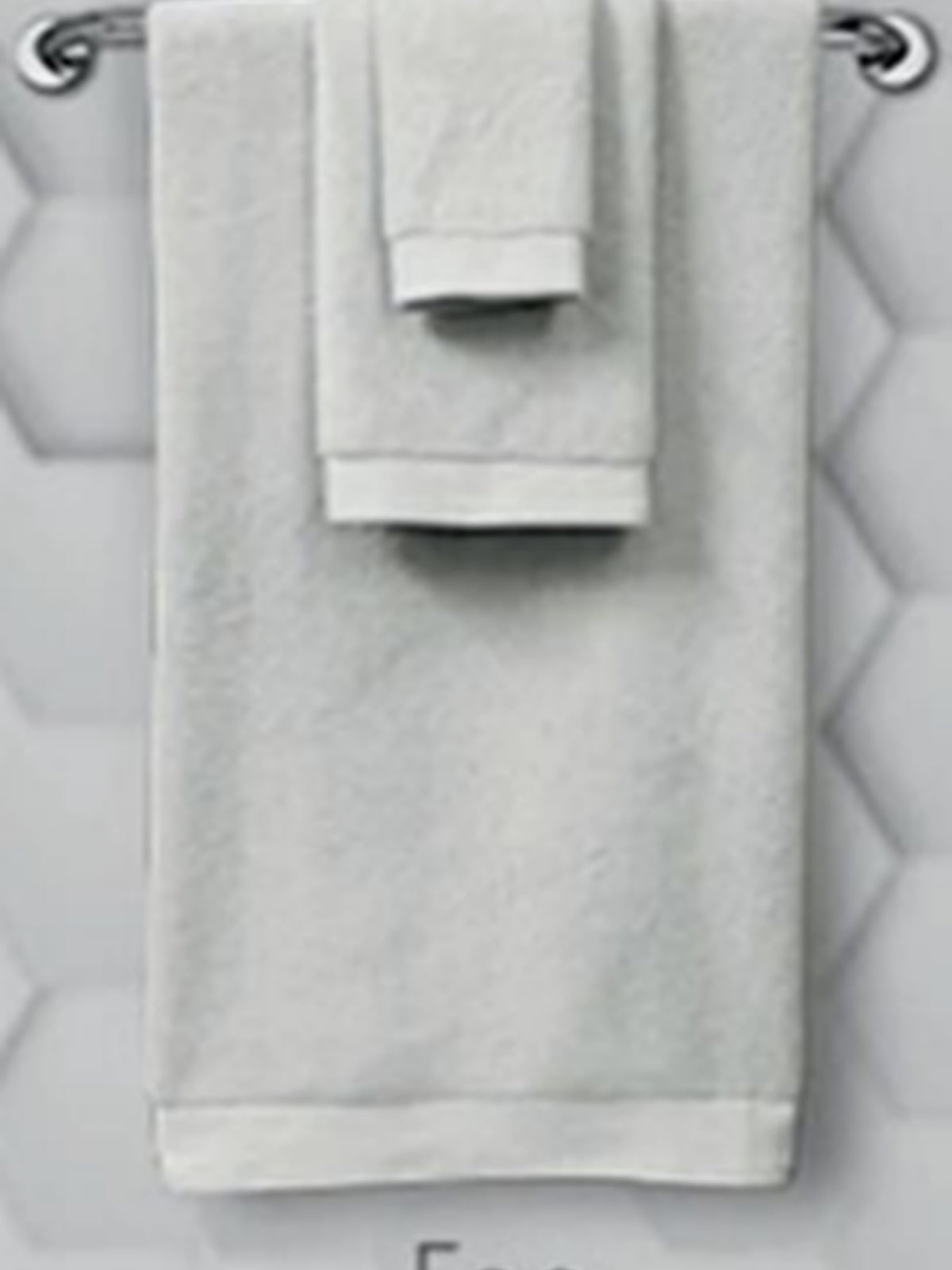 Pale silver cotton towel set hanging on a rail, Resort Towel in Silver