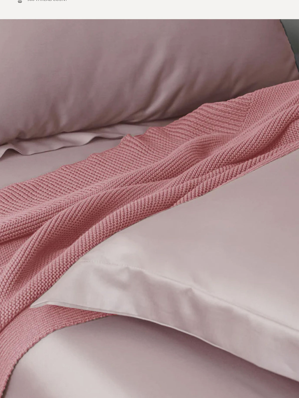 Blush pink Supima cotton bedding with a pink waffle throw