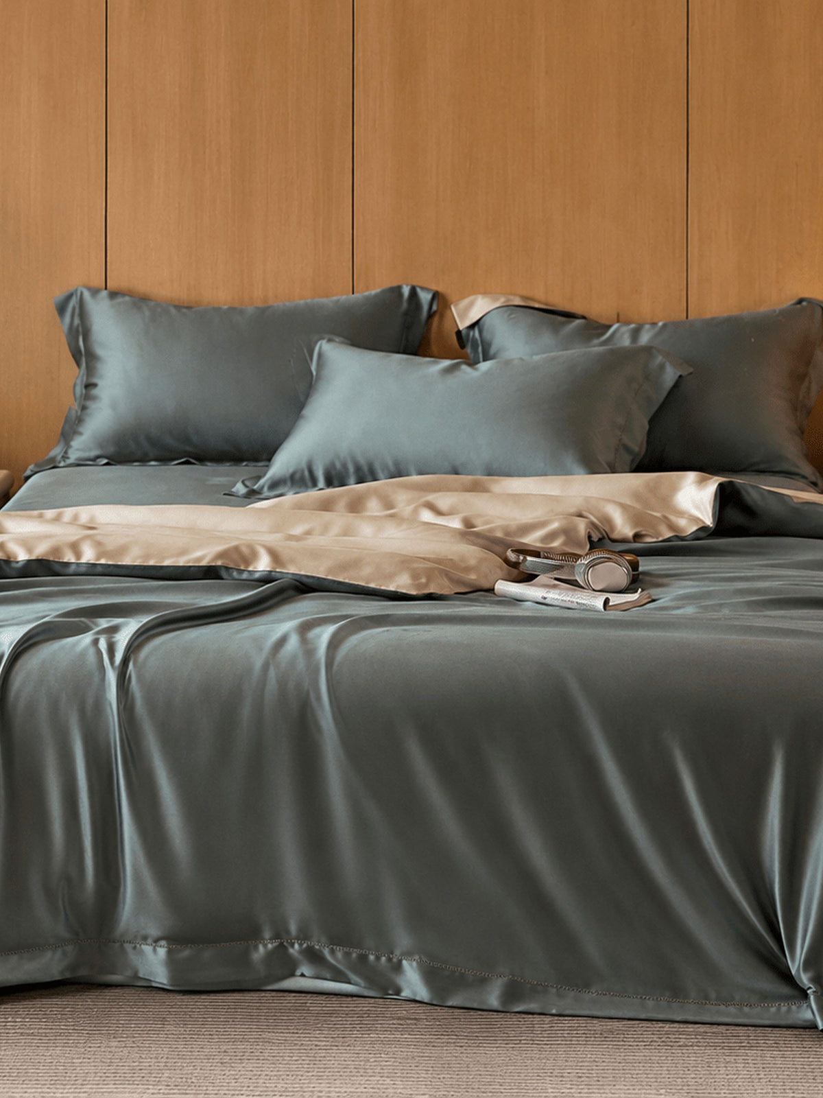 Slate teal Tencel bedding set against a wood-panelled headboard
