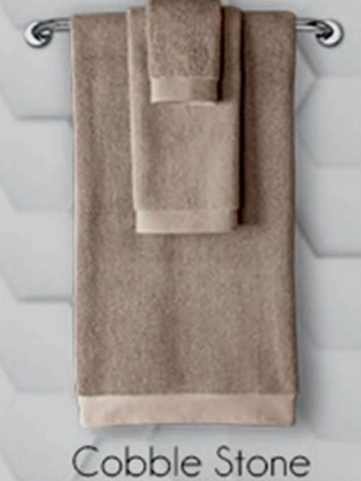 Taupe cotton towel set hanging on a rail, Resort Towel in Cobble Stone