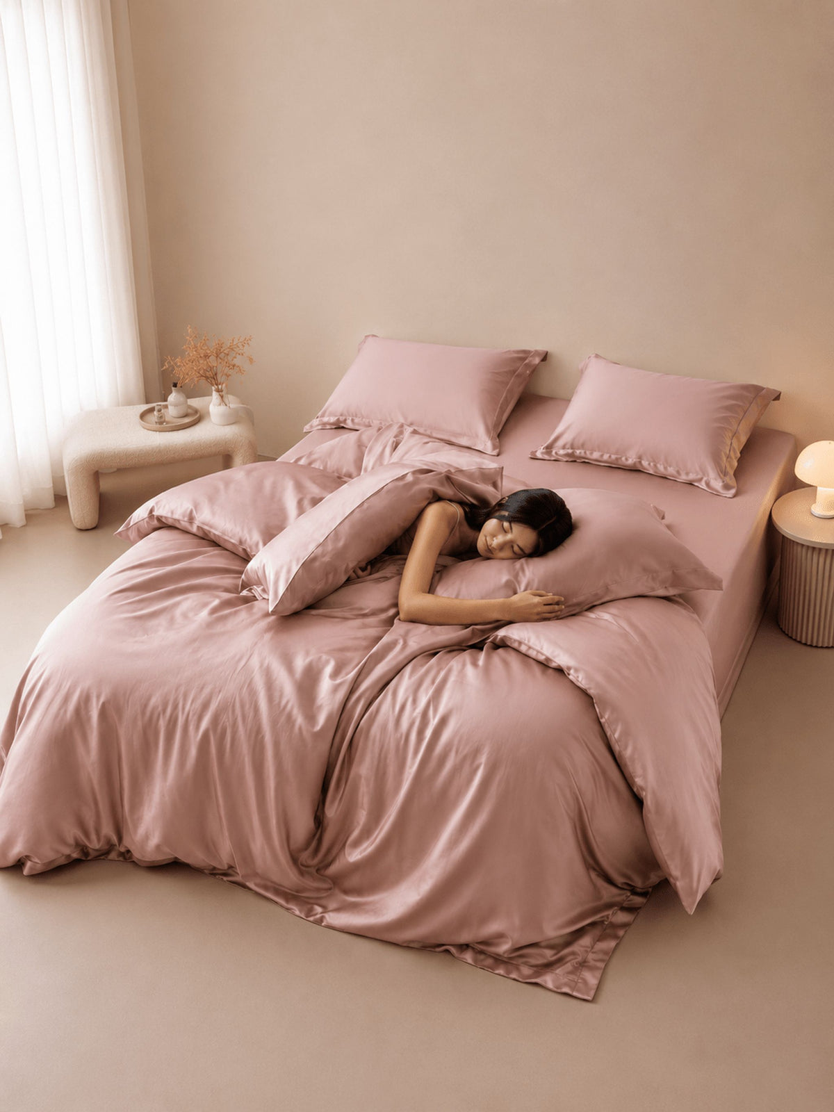 Blush Tencel bedding set with duvet cover, made up in a bright bedroom