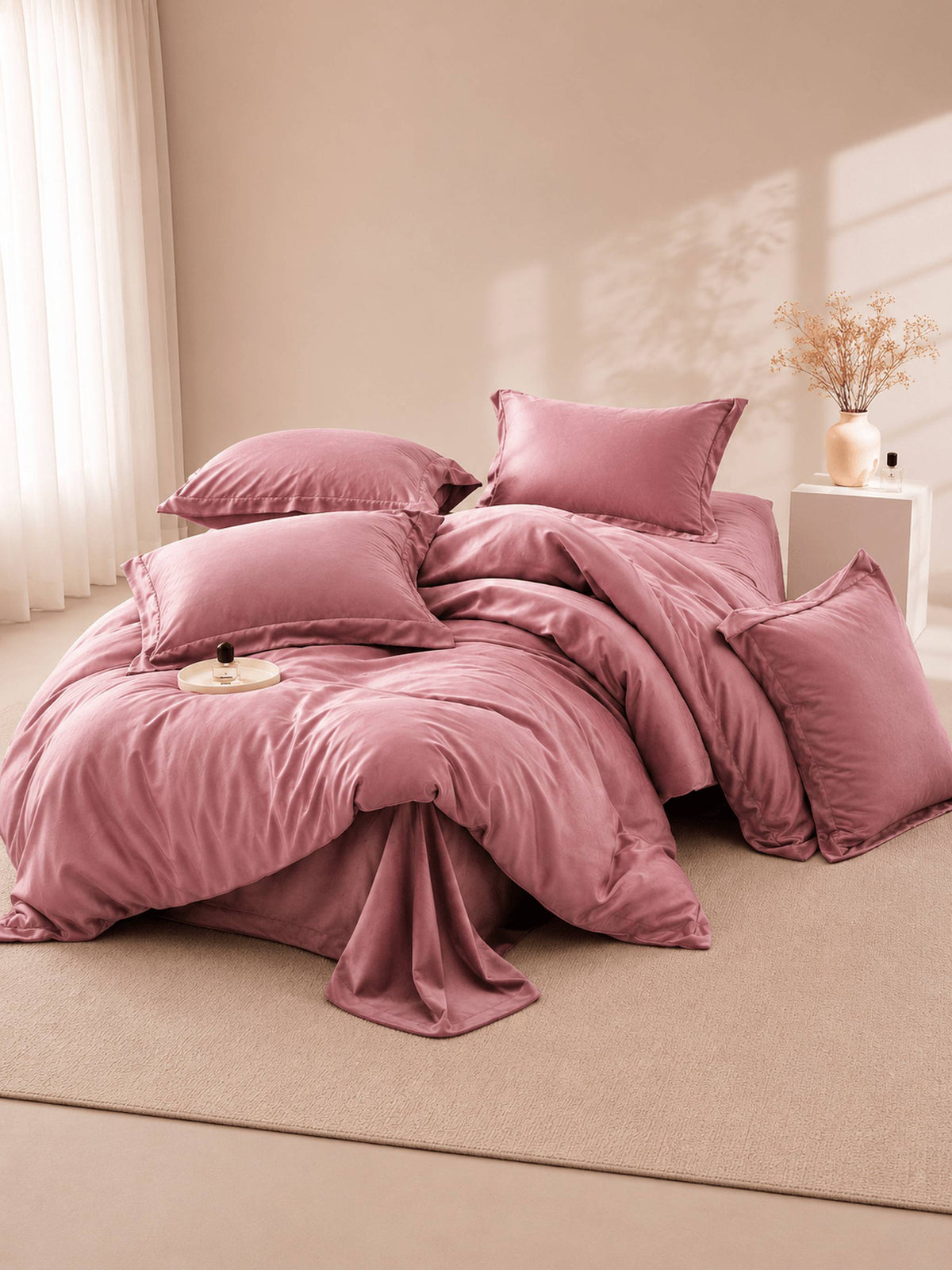 Dusty rose Tencel duvet cover with matching pillows in a sunlit room