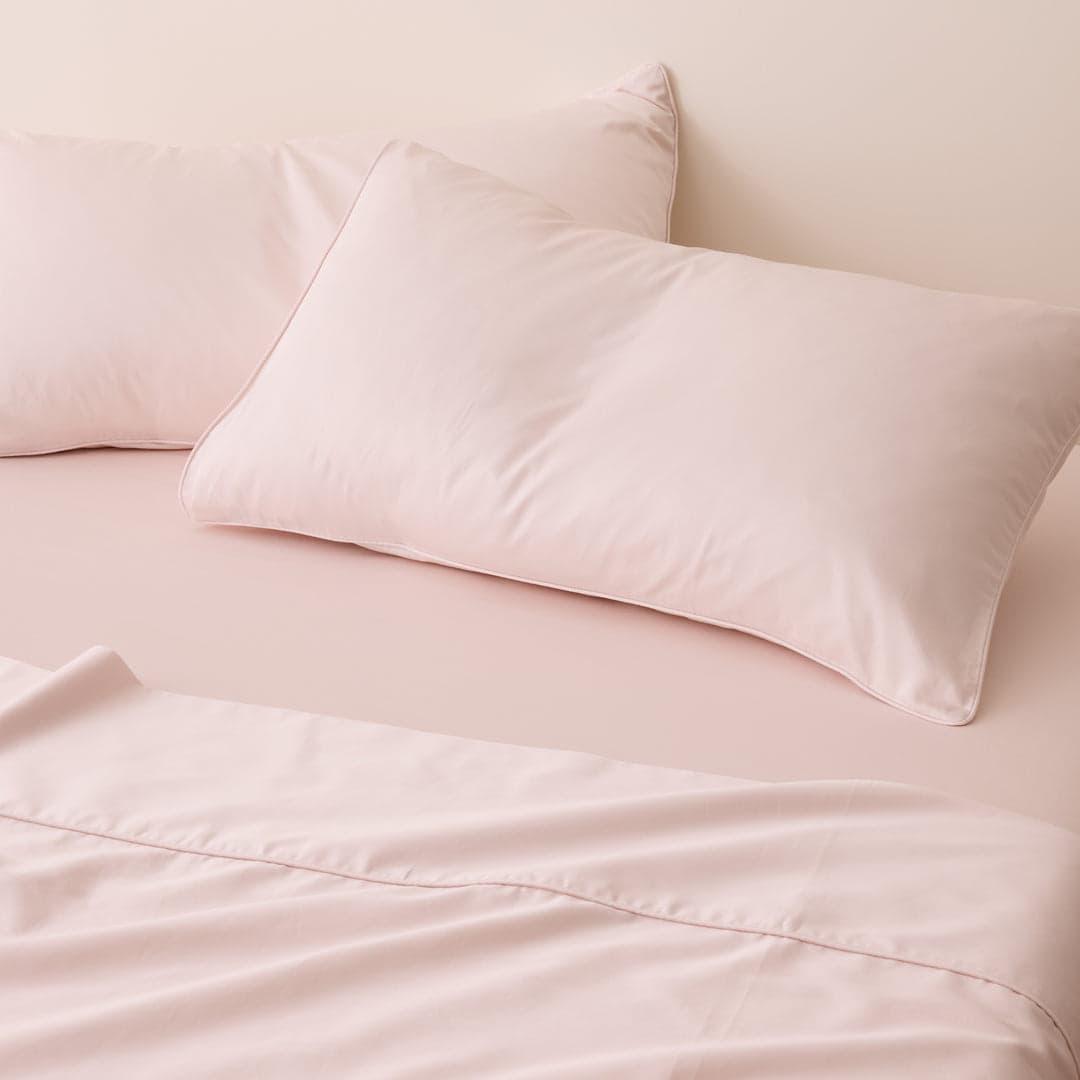 Blush pink pillow and fitted sheet close up, Blush Luxe Collection