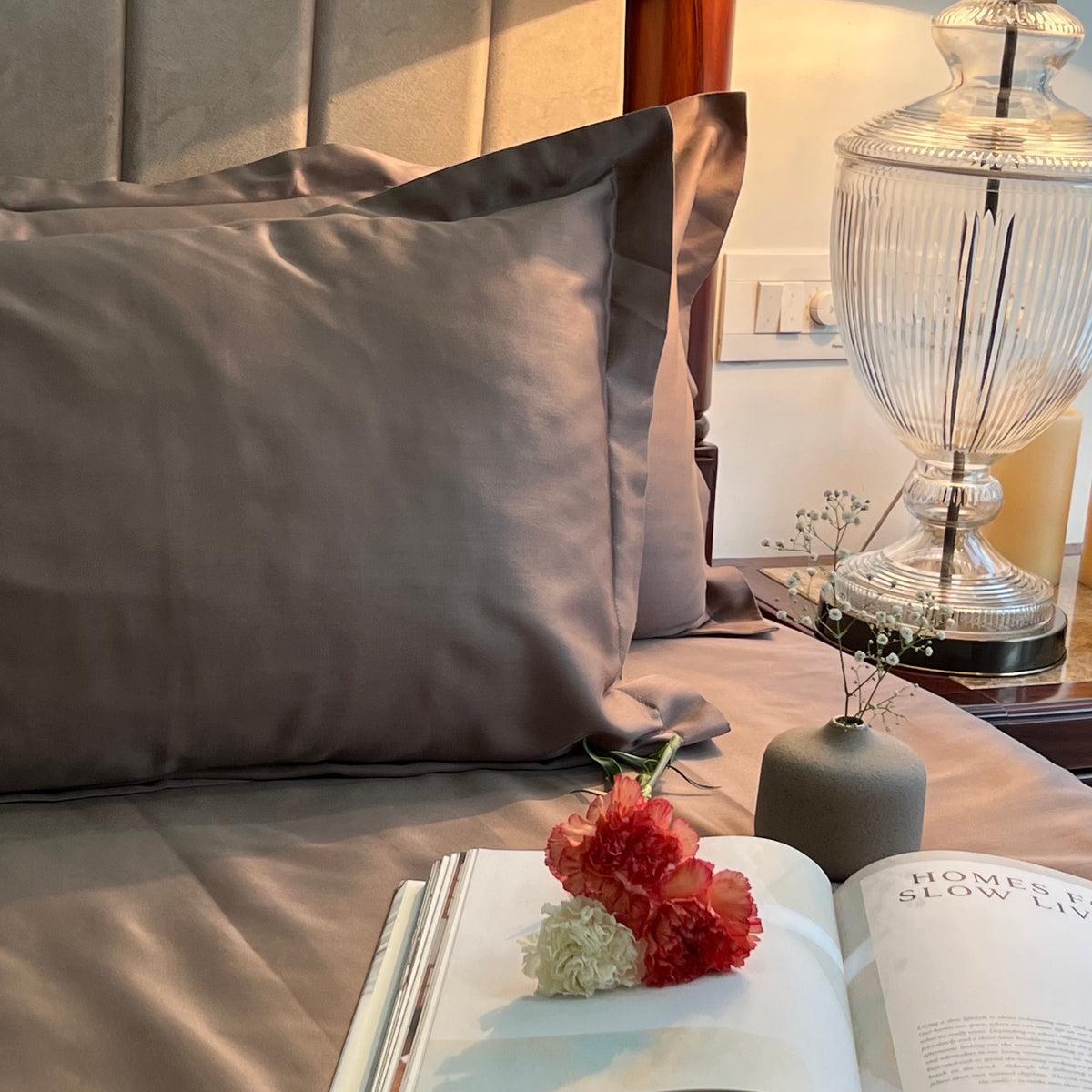 Taupe sateen oxford pillow with an open book and carnations, Taupe Luxe Collection