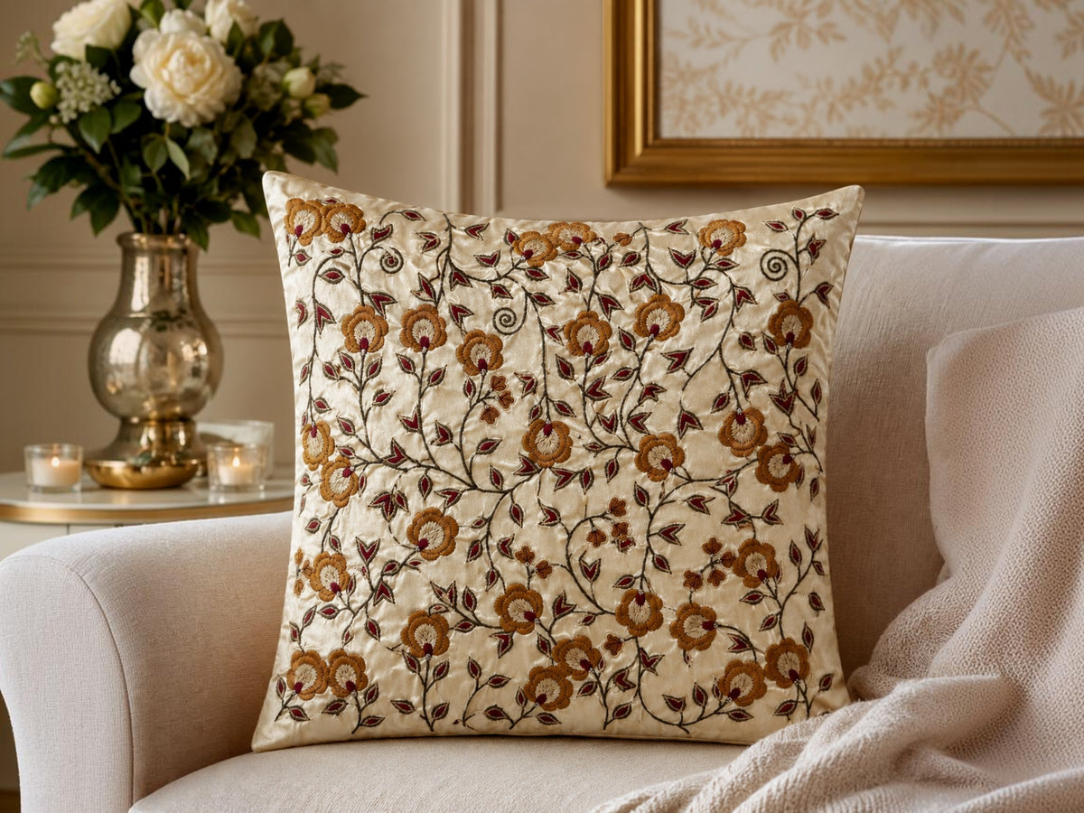 Jagdish Store 16x16 cream cushion cover with gold and burgundy floral embroidery and delicate beadwork accents.