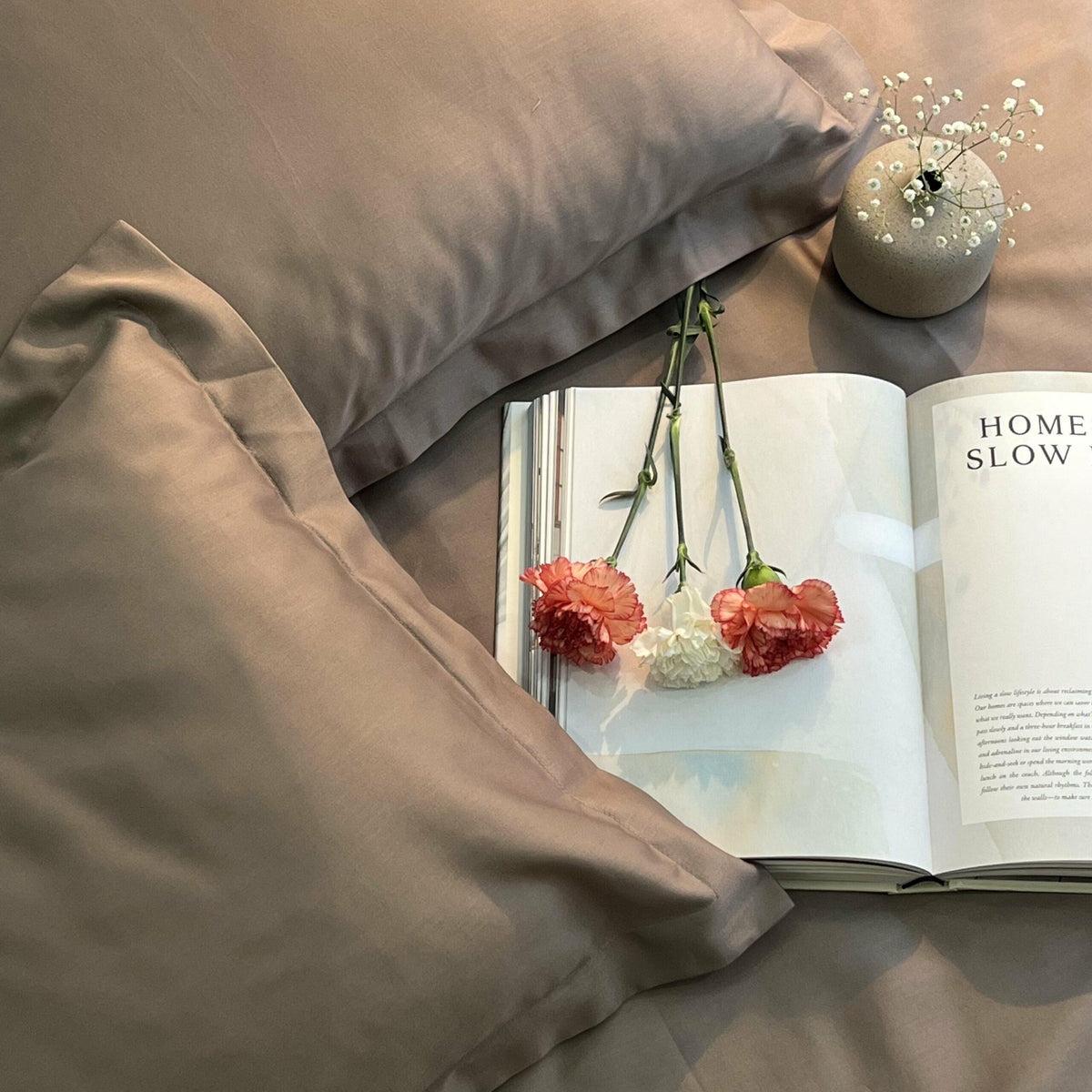 Taupe sateen duvet and pillows with carnations on a book, Taupe Luxe Collection