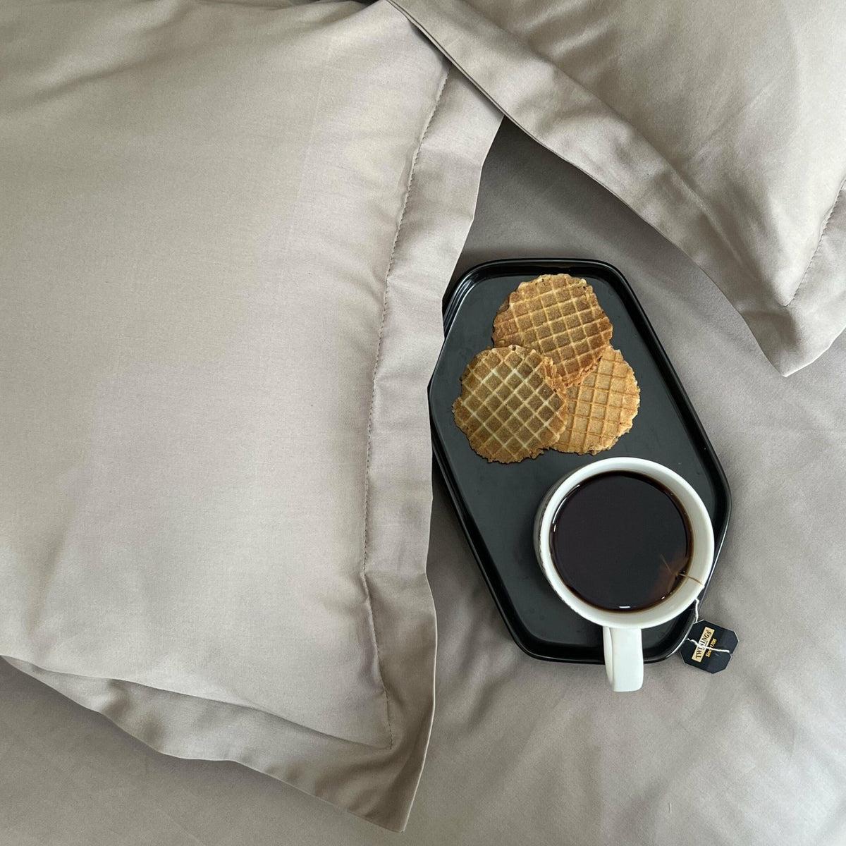 Greige sateen bedding close up with a coffee tray, Greige Luxe Collection