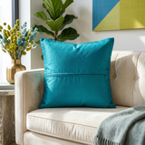 Jagdish Store decorative cushion cover with blue floral silk appliqué on a textured lime green silk-blend background.