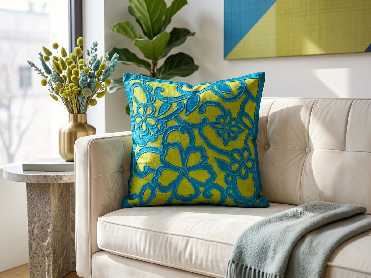 Jagdish Store decorative cushion cover with blue floral polysilk appliqué on a textured lime green polysilk-blend background.